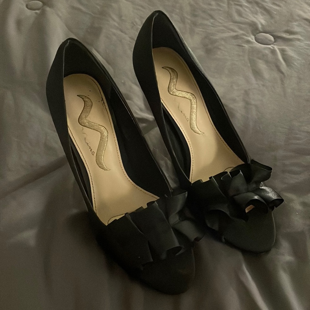 Ruffled black high heels